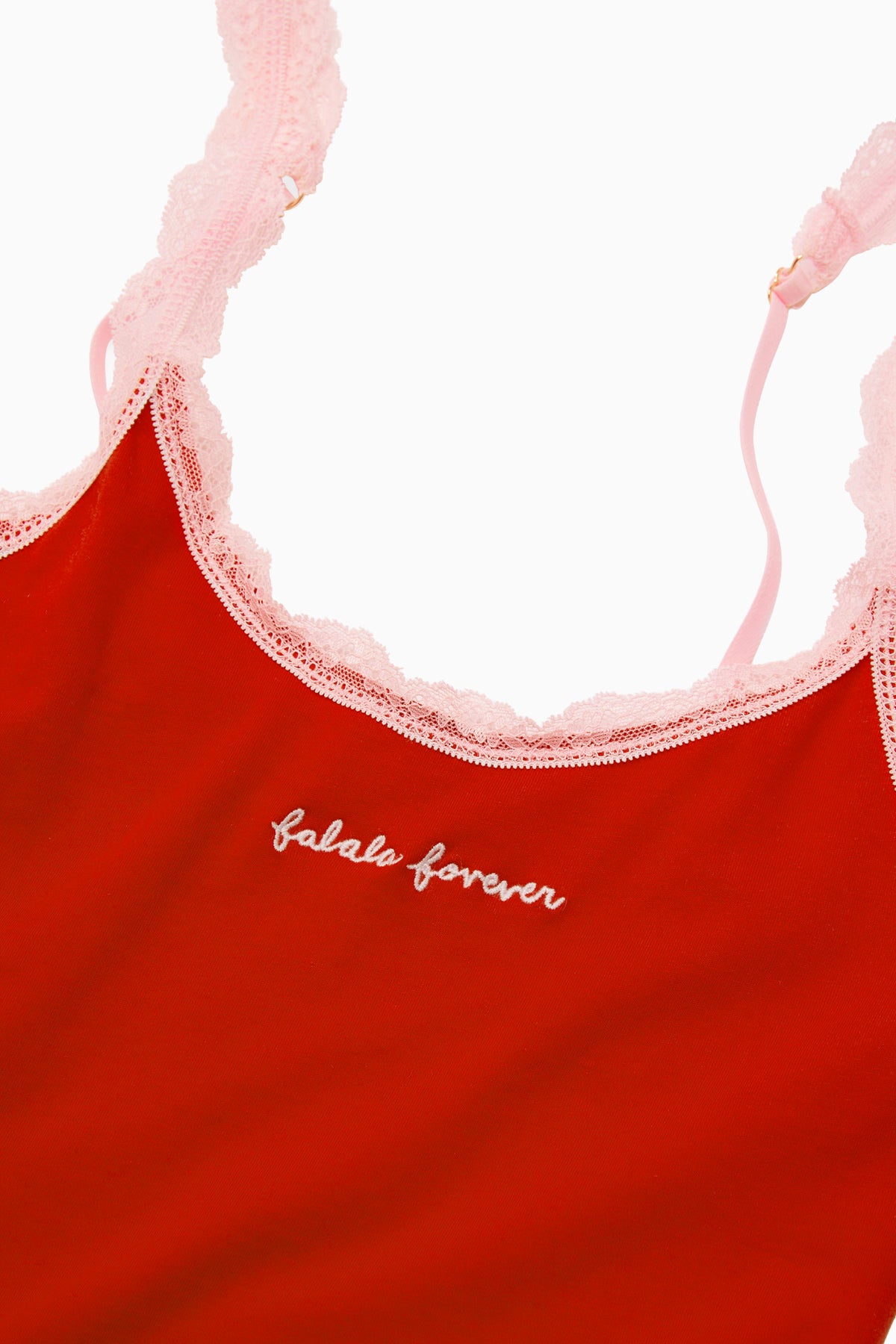 Red cotton cami with pink lace trim and script logo on the front