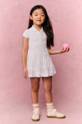 White eyelet dress with collar, short sleeves, and flared skirt for movement