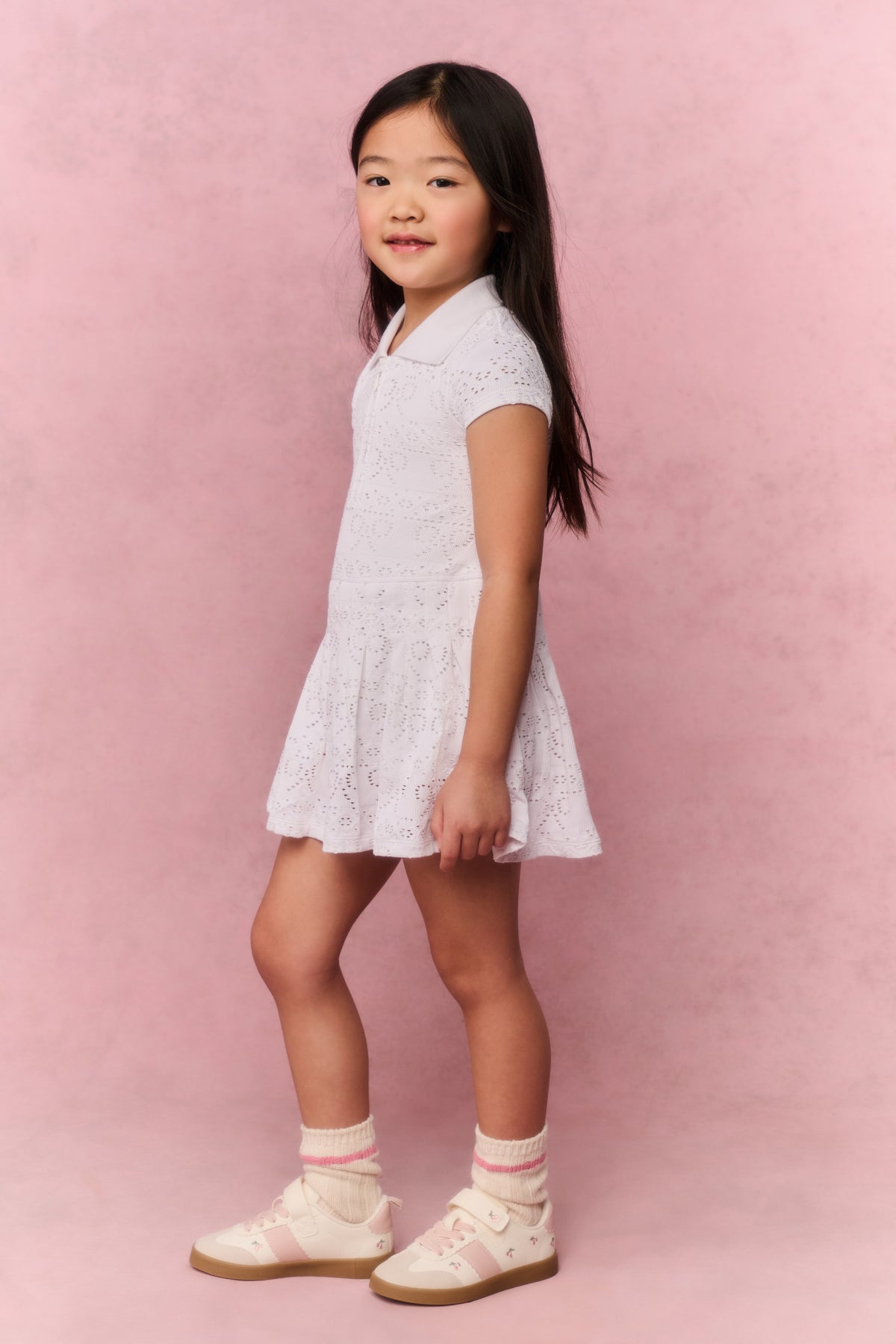 White eyelet short-sleeve dress with collar and flared hem for active wear