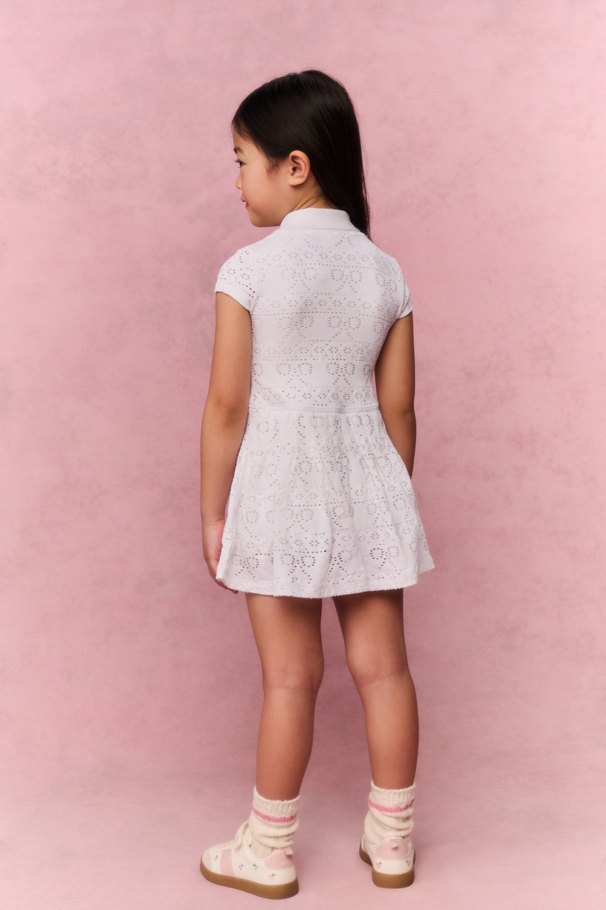 White eyelet active dress, back view with short sleeves and gathered waist