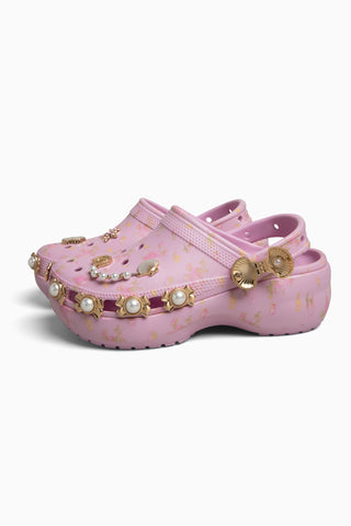 Pink platform clogs with side vents and bead-and-charm embellishments