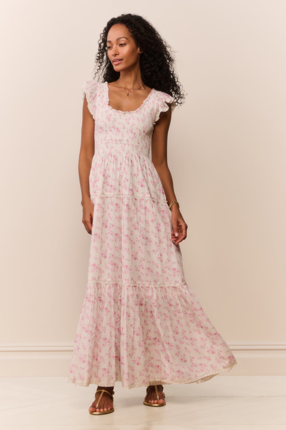 Pink floral maxi dress with tiered skirt and scoop neckline, full length