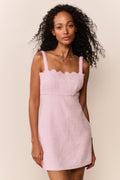 Blush lace-trim tweed mini dress with spaghetti straps and fitted mini hem.