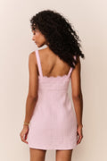 Blush lace-trim tweed mini dress with spaghetti straps, back view.