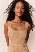 Tan suede eyelet mini dress with scalloped neckline and embroidered bodice