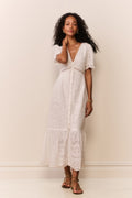 White cotton eyelet midi dress with button-front, tiered skirt, and puff sleeves