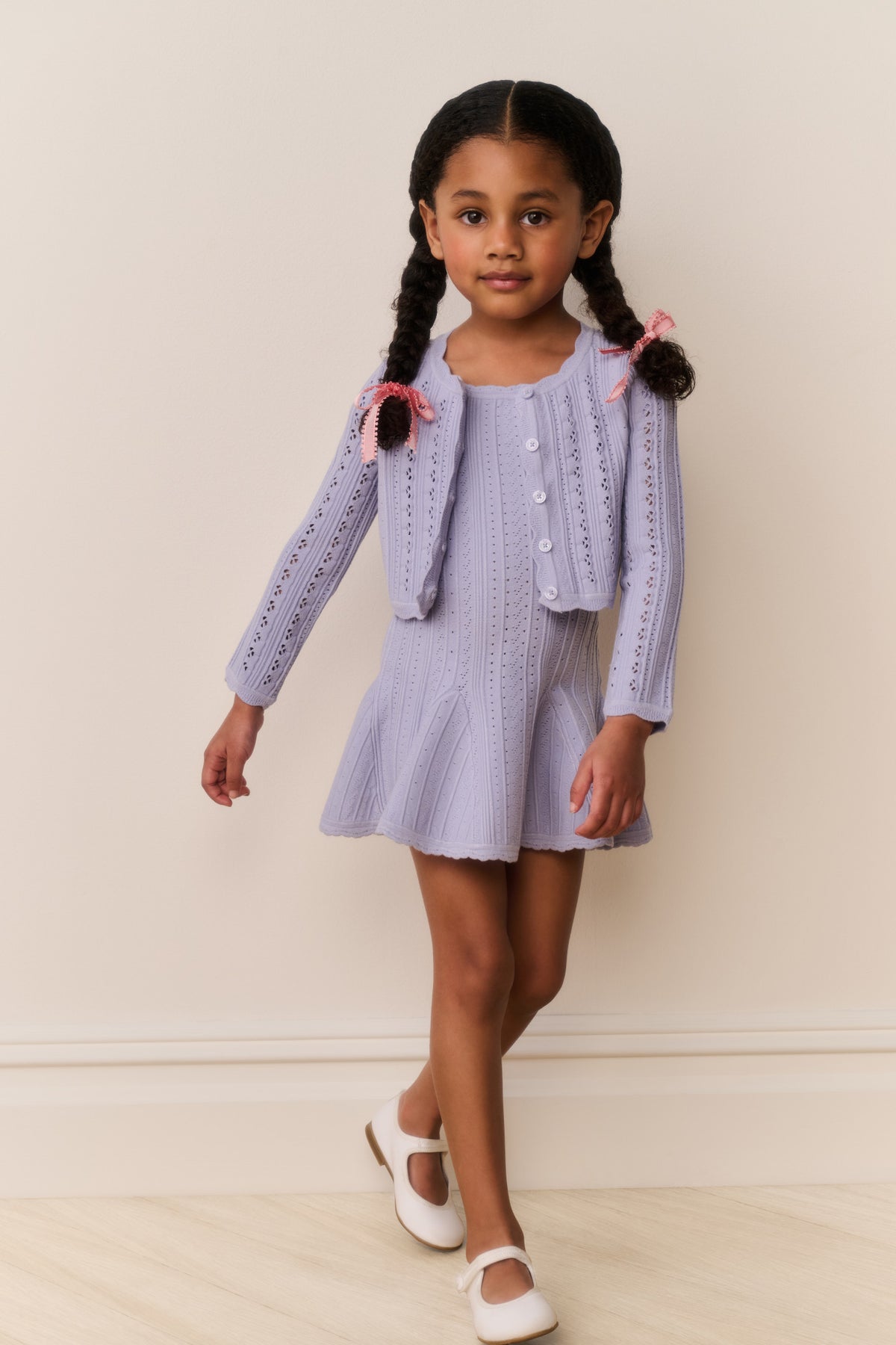 Girls lilac pointelle knit cardigan with front buttons and pink bow ties
