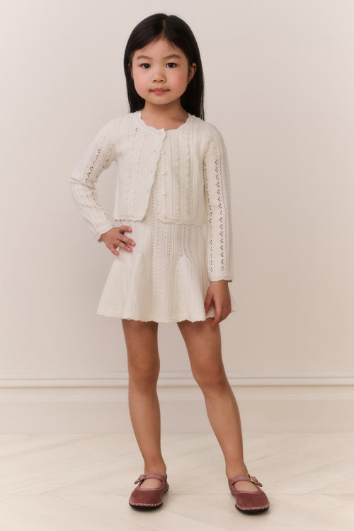 Girls cream pointelle knit cardigan with button front and long sleeves