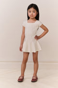 White pointelle knit girls dress with short sleeves, square neckline, flared hem