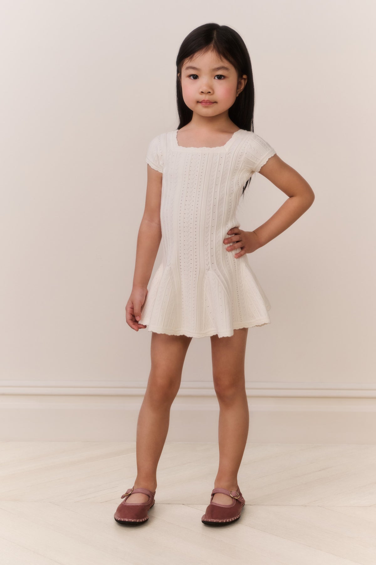 White pointelle knit girls dress with short sleeves, square neckline, flared hem