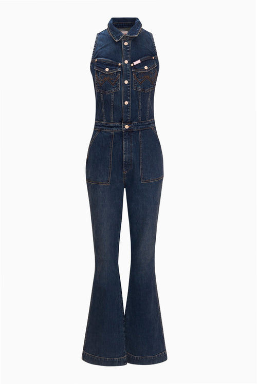 Dark wash denim jumpsuit, sleeveless with buttoned front and front flap pockets.