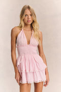 Pink halter ruffle mini dress with smocked bodice and tiered skirt