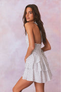 Antique white polka dot halter mini dress, open back detail and ruffle tiers