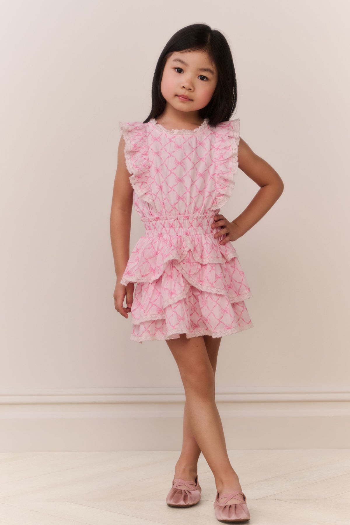 Pink tiered ruffle mini dress with square neckline and diamond texture