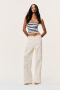 Ivory eyelet floral cutout wide-leg jeans with full-length embroidered eyelets