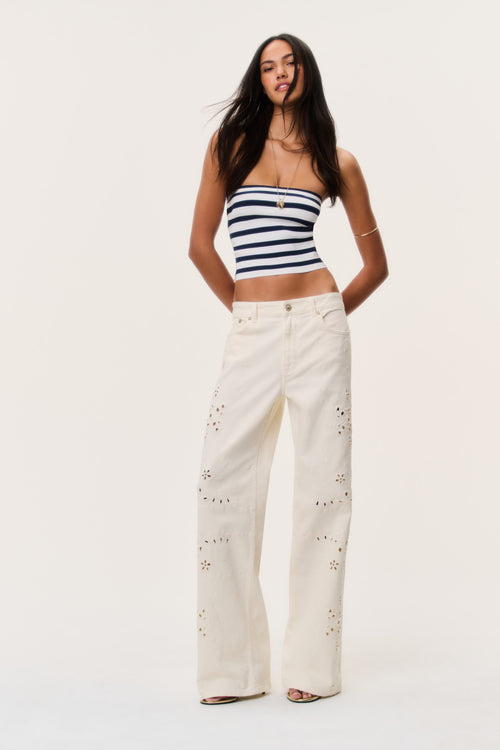 Ivory eyelet floral cutout wide-leg jeans with full-length embroidered eyelets