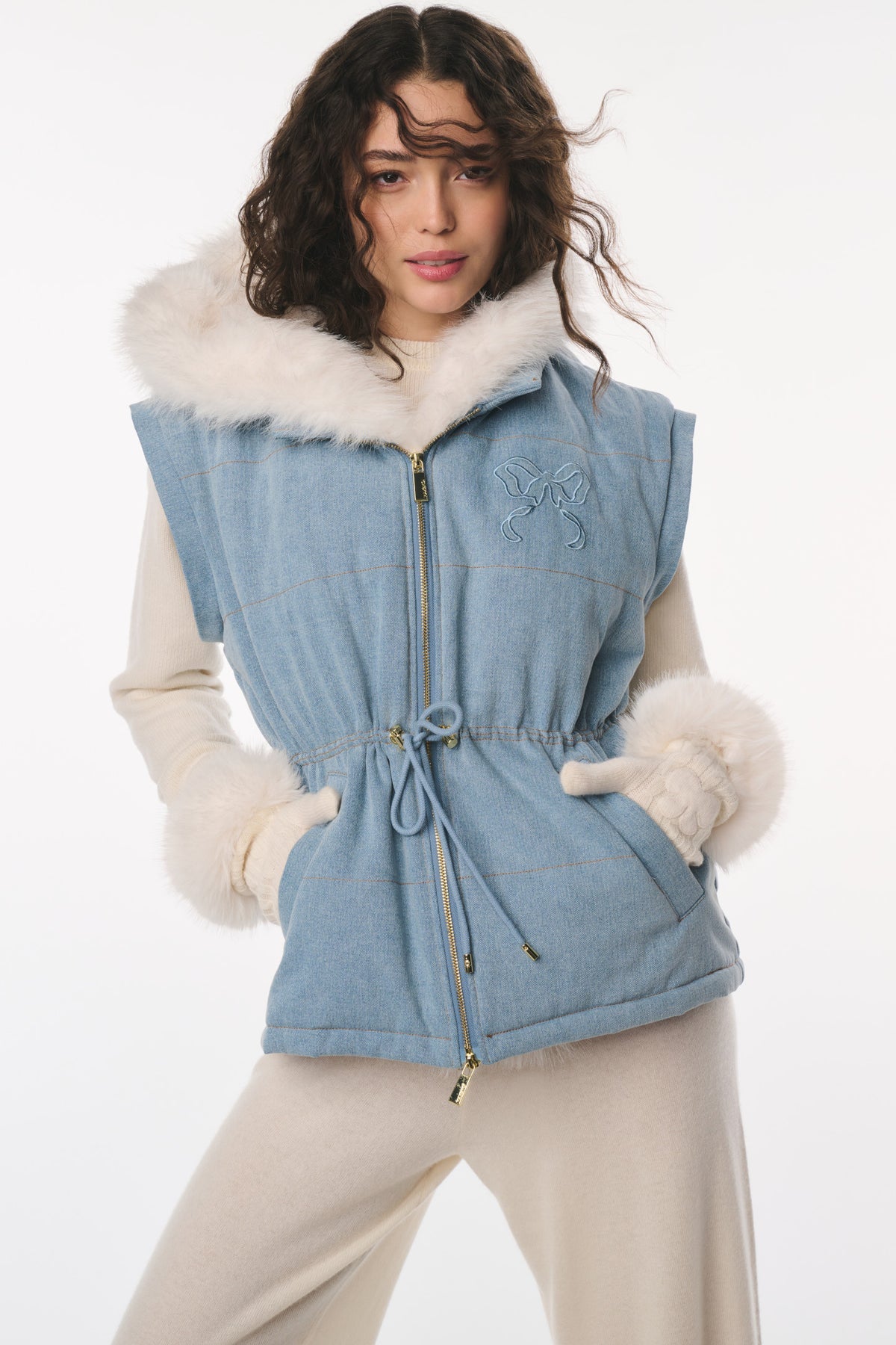 Light blue denim convertible jacket with faux fur hood, drawstring waist and zip front