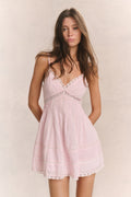 Docila Heritage cotton mini dress in light pink, V-neck, tiered panels, lace-trim hem