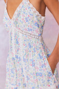 Upcycled cotton mini dress bodice with V-neck lace trim and light blue floral pattern