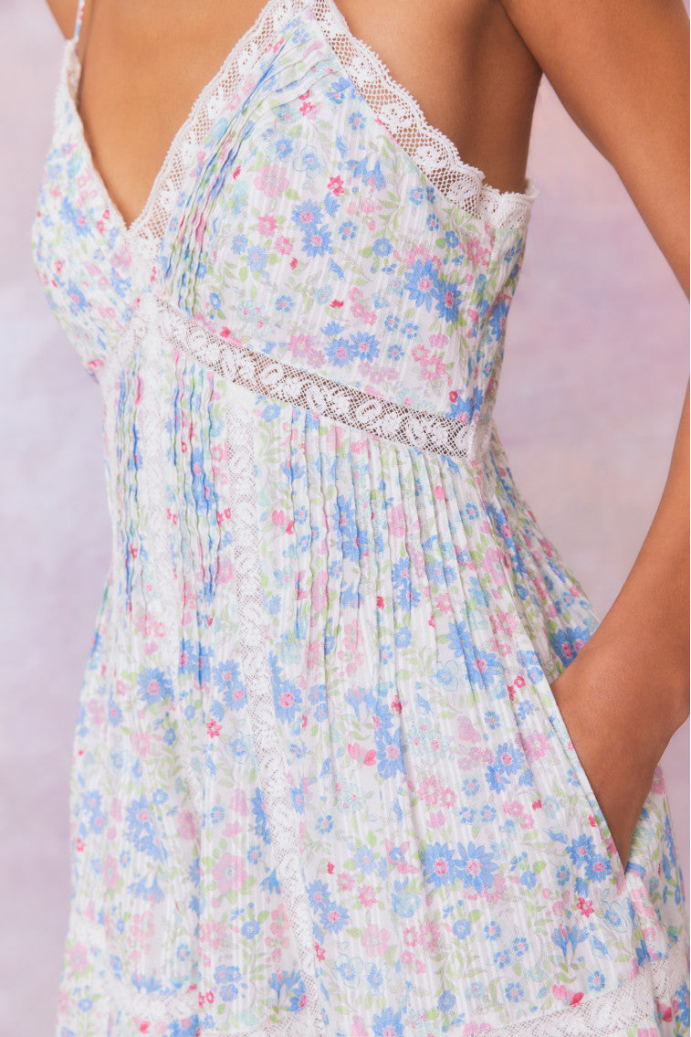 Upcycled cotton mini dress bodice with V-neck lace trim and light blue floral pattern