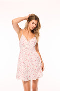 White mini dress with pink floral print, V-neck, lace hem, spaghetti straps.