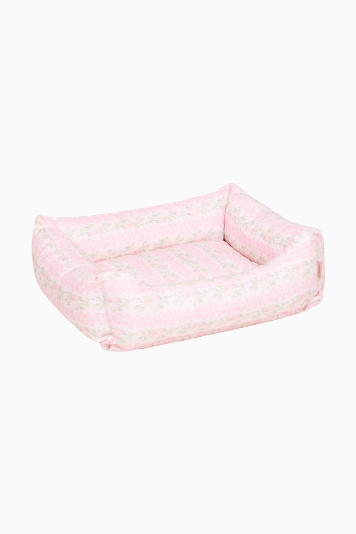 Light pink printed dog bed with cushioned walls and open center