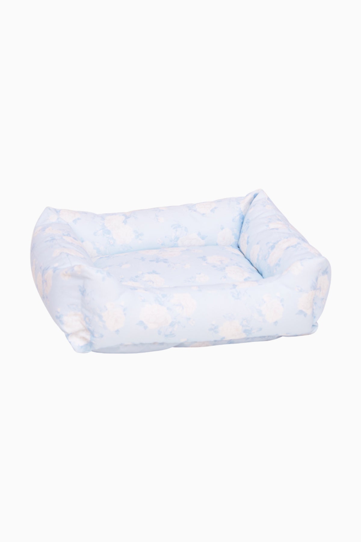 Light blue printed dog bed with padded bolsters and open top