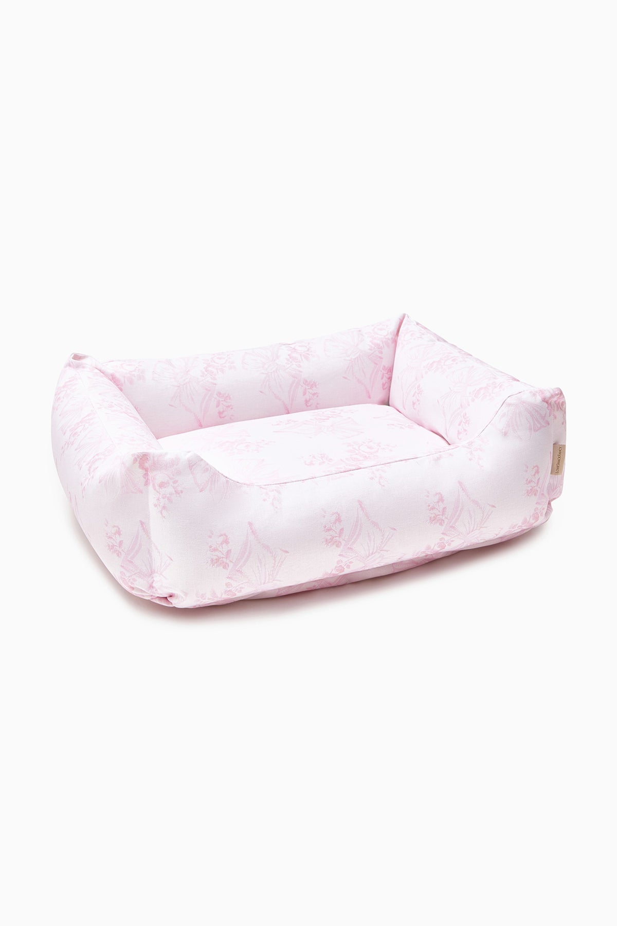 Pink printed dog bed with soft inner cushion and raised bolsters