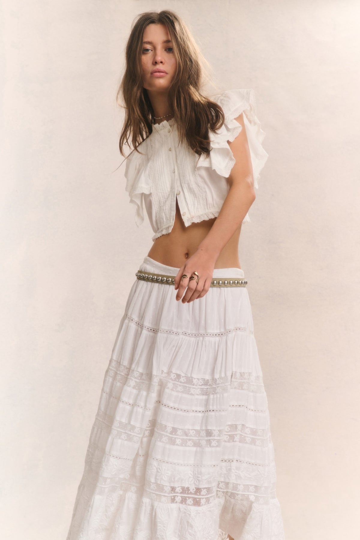 White tiered midi skirt with tiered ruffles and textured stitched panels