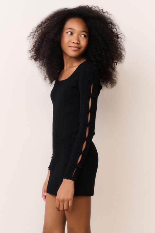 Black tween knit mini dress side view with long sleeves and lace-up panel