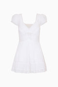 White cotton Victorian mini dress, V-neck with lace trim, puff sleeves, tiered skirt