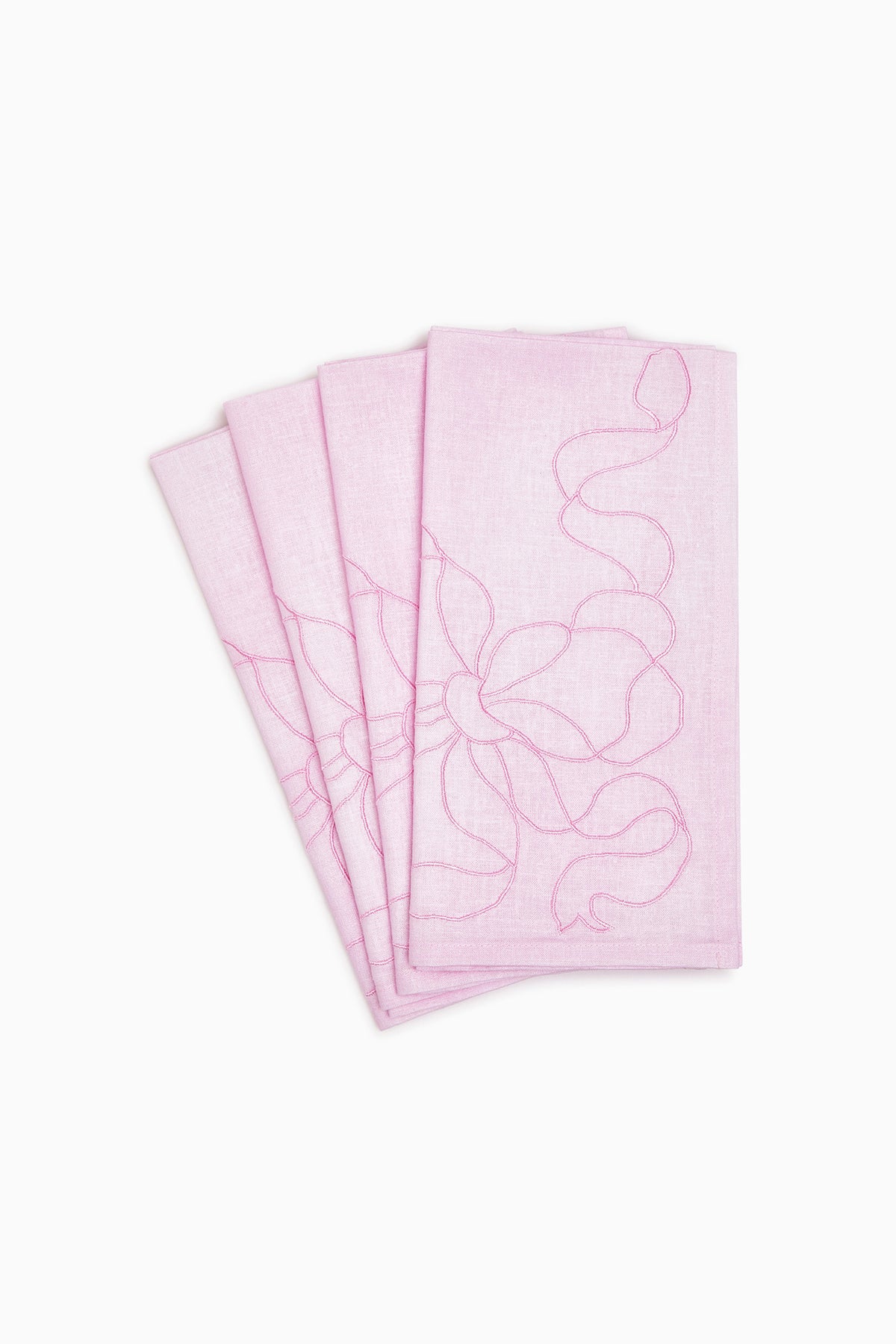 Set of four embroidered linen bow napkins, dusty pink with outline bow pattern