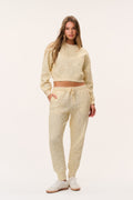 Ditsy floral cream sweatpants with elastic drawstring waist and relaxed tapered legs