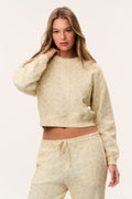 Faint yellow cropped pullover with tiny ditsy floral print, crew neck, long sleeves