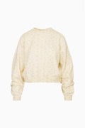 Faint yellow cropped pullover with tiny ditsy floral print, crew neck, long sleeves