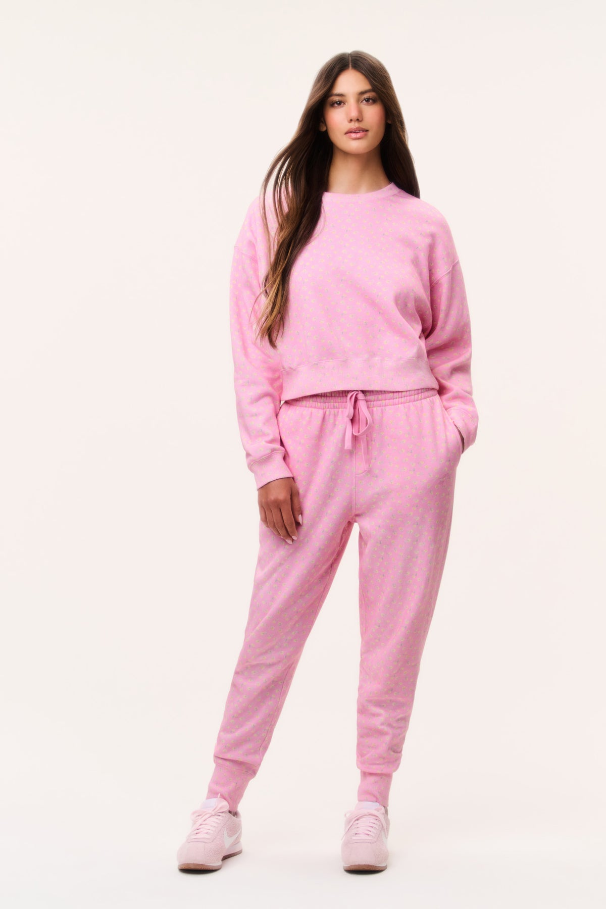 Ditsy floral pink sweatpants with elastic drawstring waist and tapered cuffs