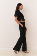 Black lace chiffon cropped top with short ruffled sleeves, side view