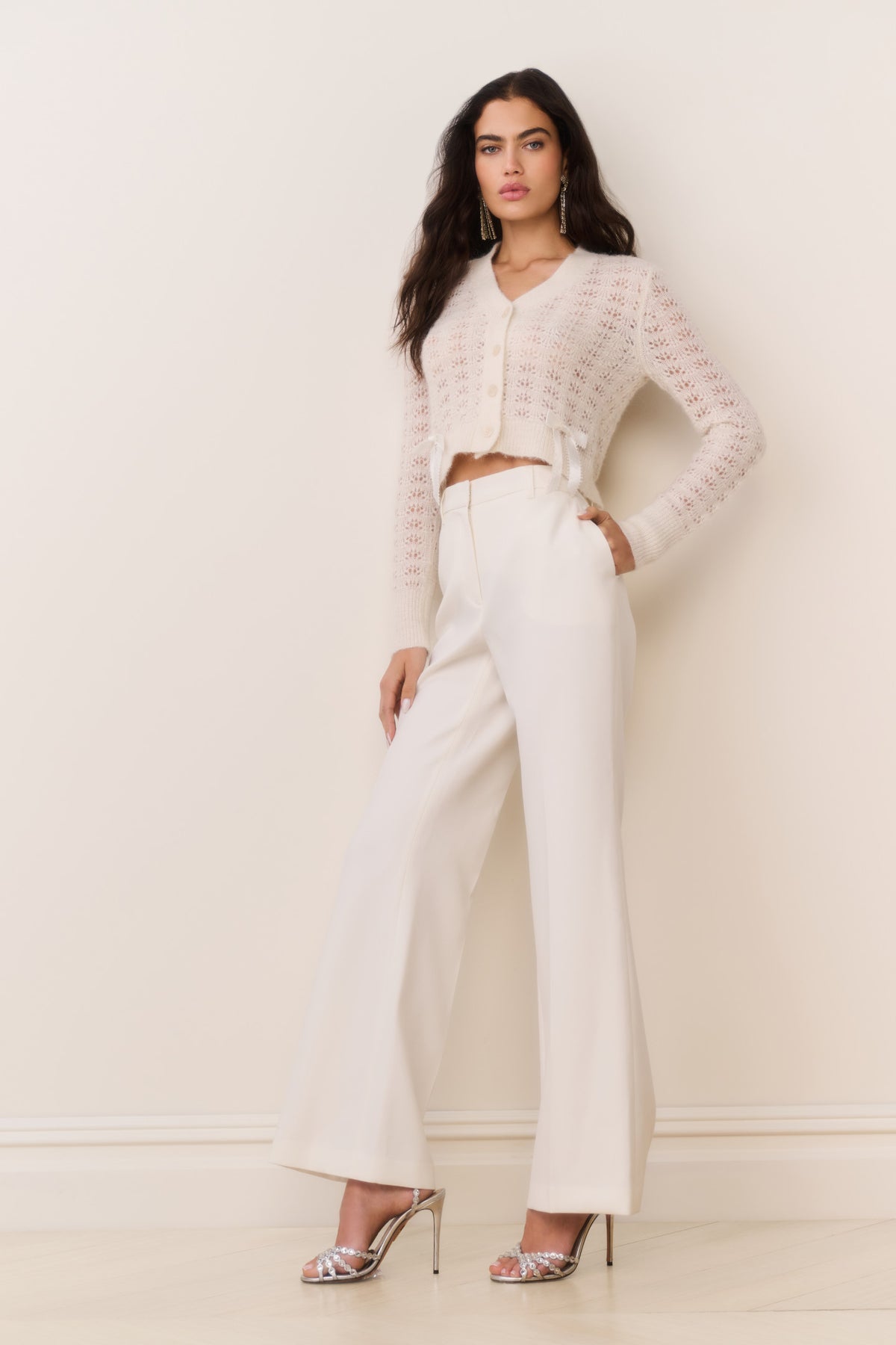 Cream wide-leg trousers with wide cuff hem and tailored waistband