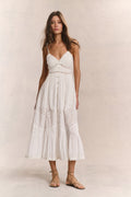 White cotton midi dress with spaghetti straps, button front, and tiered skirt