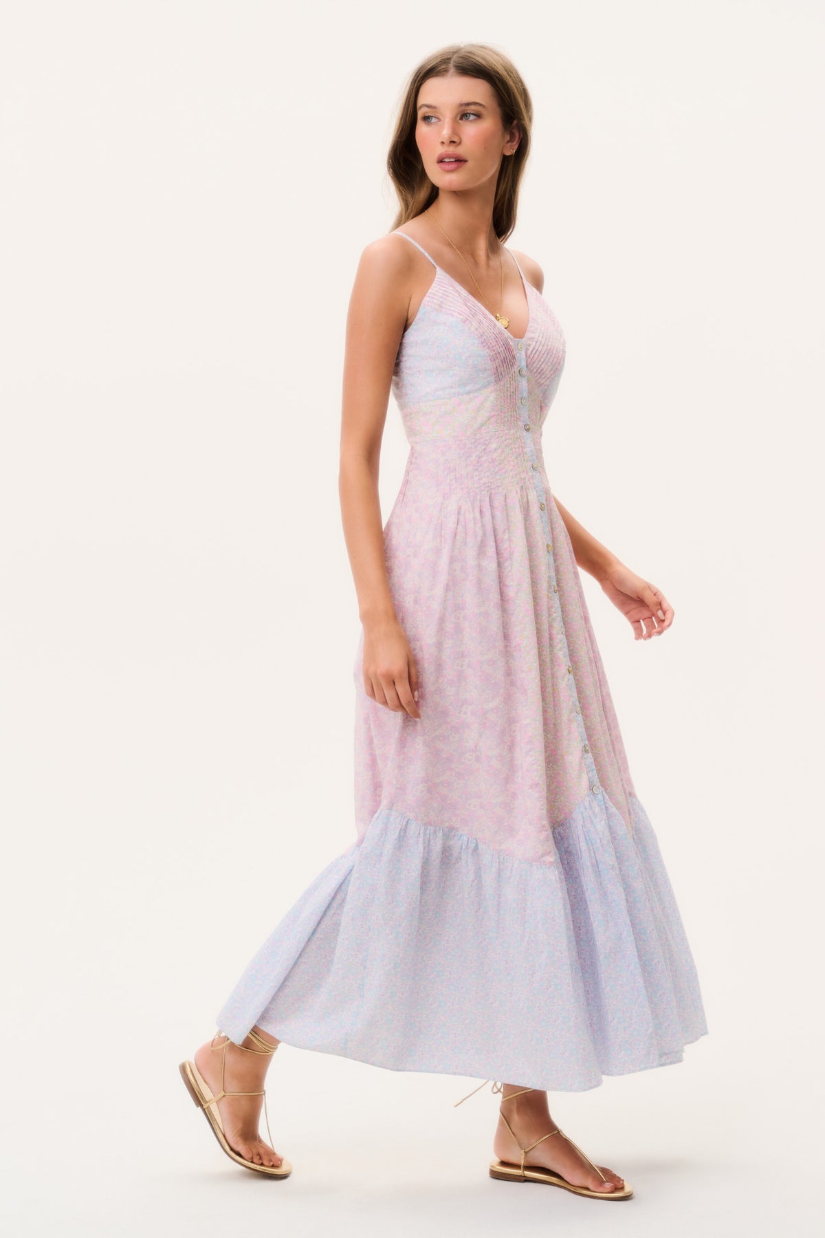 Side view V-neck maxi dress with spaghetti straps, pink-and-blue floral print, tiered hem