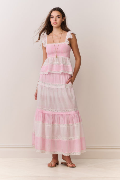 Pink tiered maxi skirt with ruffled tiers and mixed print paneling