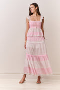 Tiered pink maxi skirt with ruffled tiers and mixed print design