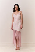 Pink floral maxi dress with V-neck straps and layered fringe at the hem.