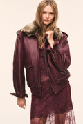 Faded merlot leather bomber jacket with faux fur collar and flap chest pockets