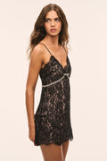 Black lace mini dress with spaghetti straps and bow waist trim