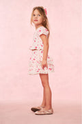 Girls pink ruffle tier skirt with heart and kiss print, knee-length