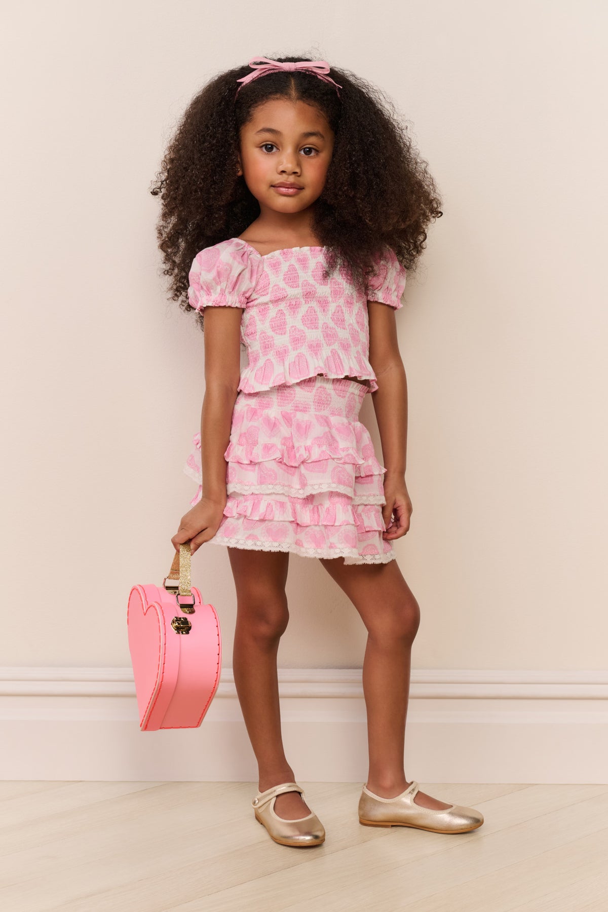 Girls pink heart print tiered ruffle mini skirt