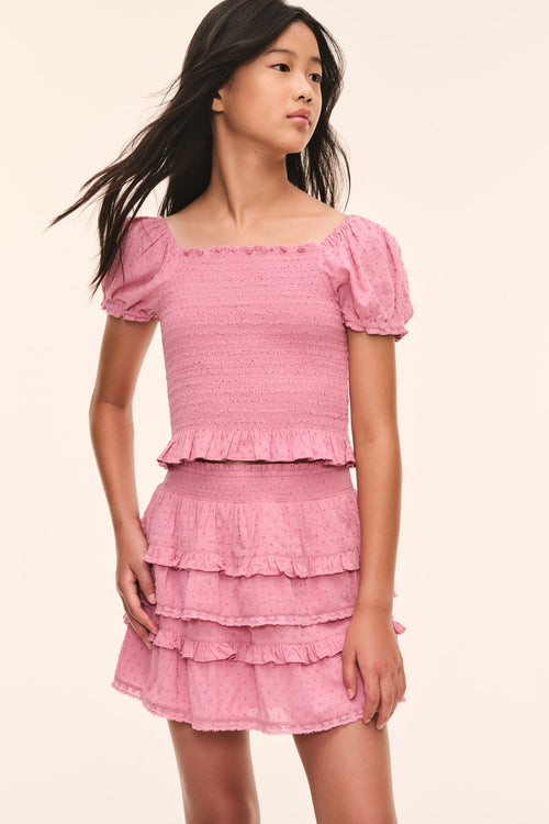 Tween pink Fabielle top with puff sleeves and layered smocked texture, front view