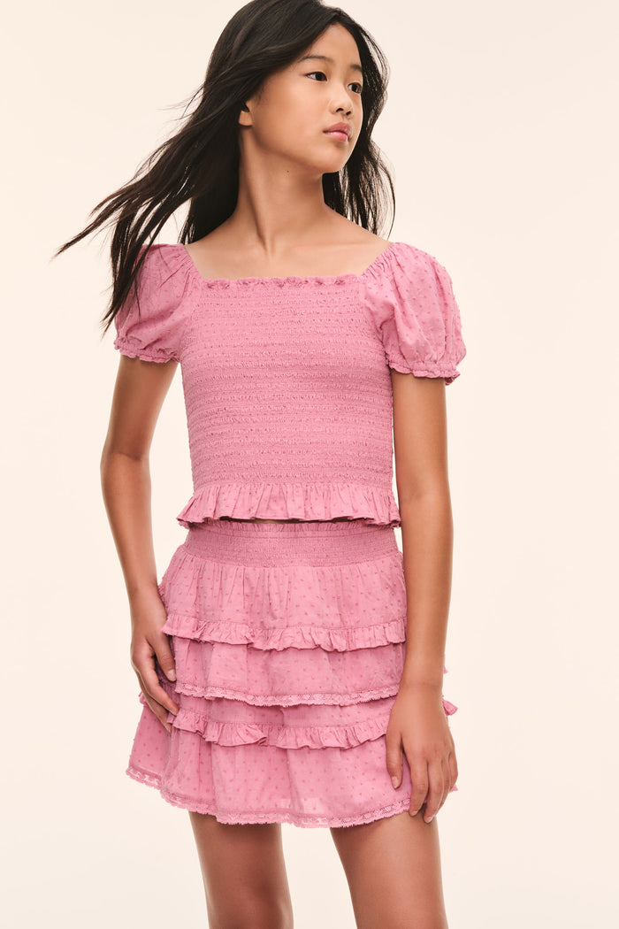Tween pink Fabielle top with puff sleeves and layered smocked texture, front view