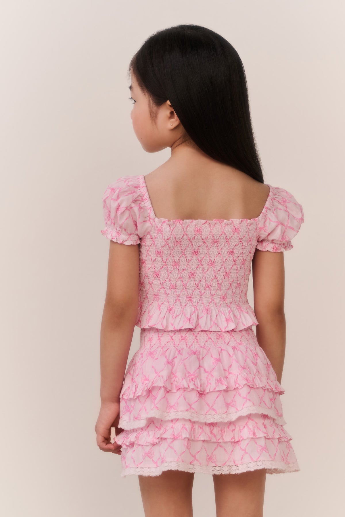 Girls pink tiered mini dress with ruffled back layers